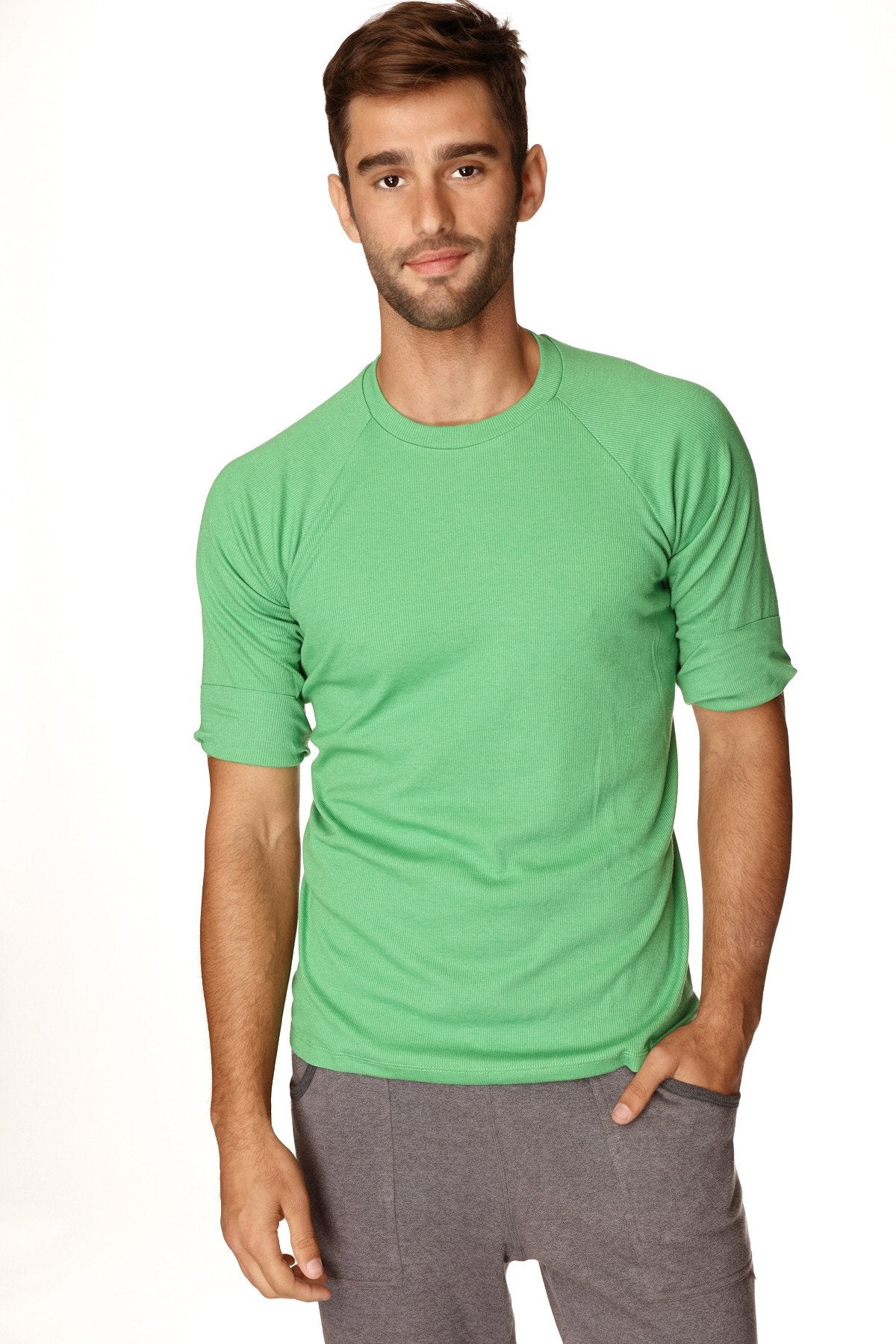 A men’s short-sleeved hybrid crew neck raglan tee in bamboo green with ribbed texture and rolled-up sleeves
