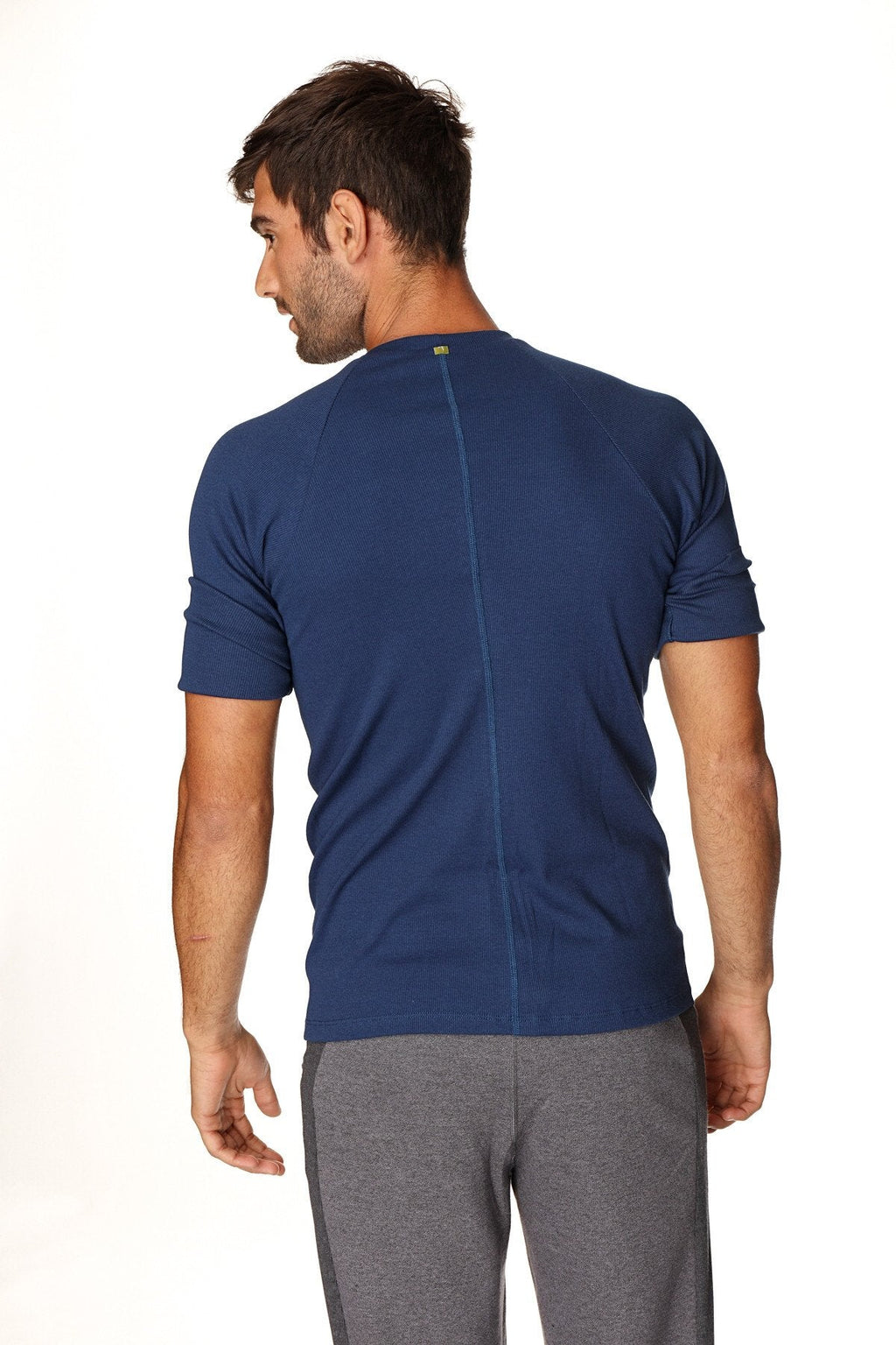 Navy blue short-sleeved hybrid crew neck raglan tee with central back seam shown from the back