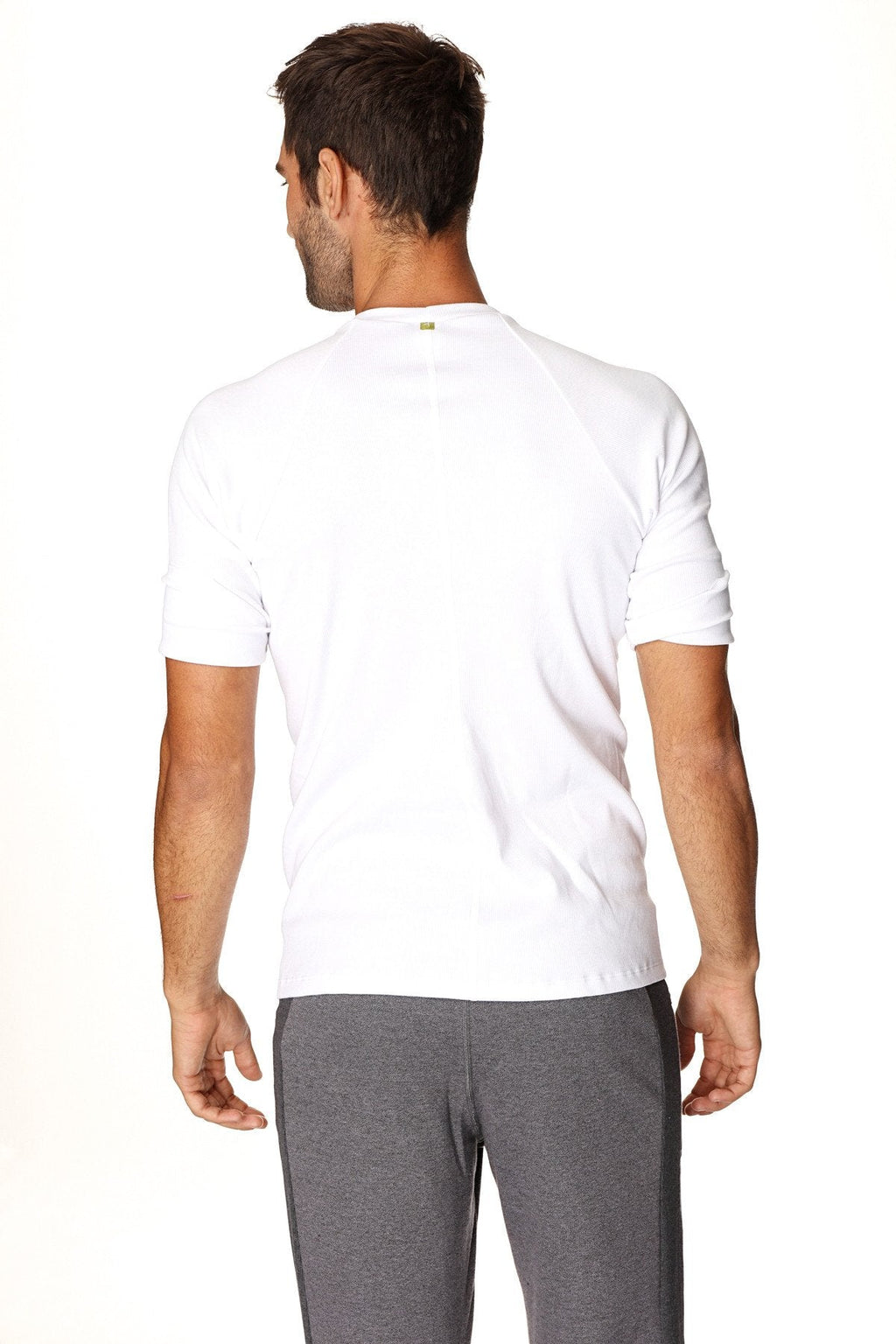 White short-sleeved hybrid crew neck raglan tee with subtle ribbed cuffs ideal for athletic wear