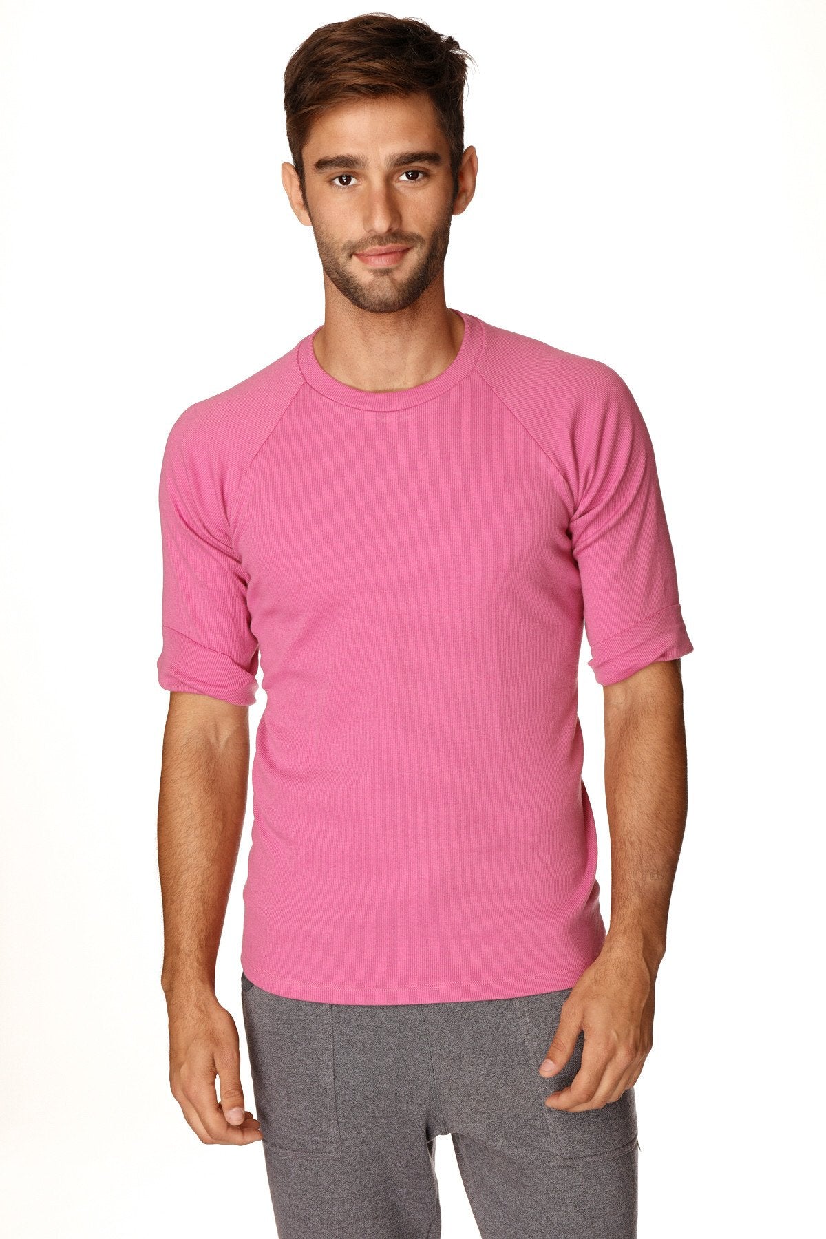 A vibrant pink short-sleeved hybrid crew neck raglan tee with round neckline perfect for casual wear