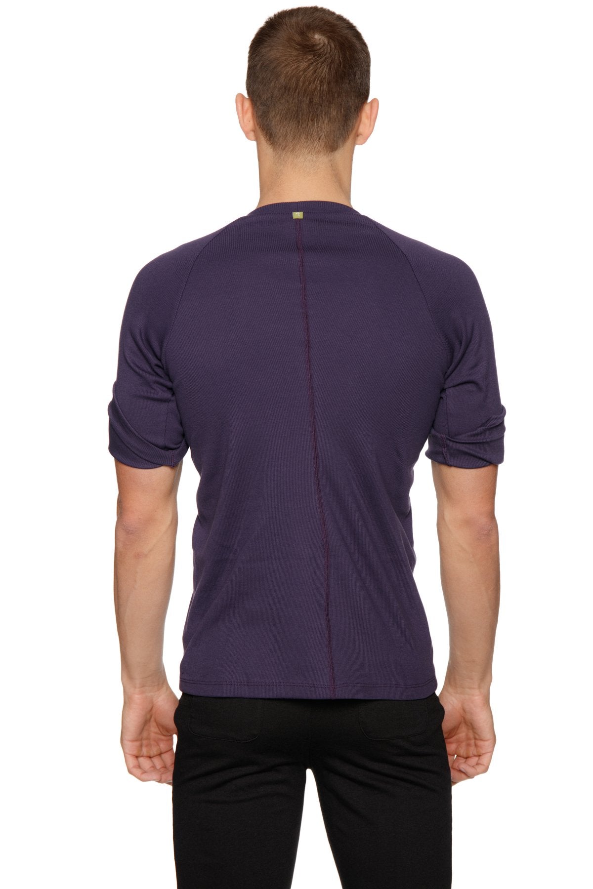 A dark purple hybrid crew neck raglan tee with short sleeves ribbed crew neck and subtle seam detailing