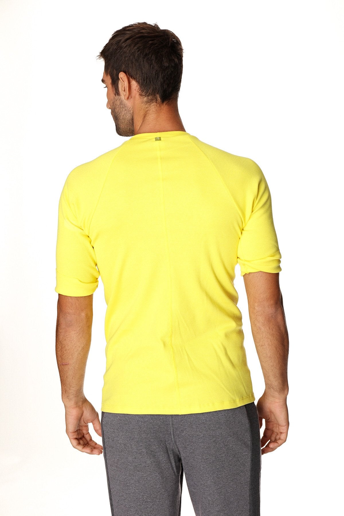Bright yellow hybrid crew neck raglan tee with short sleeves designed for athletic wear and comfort