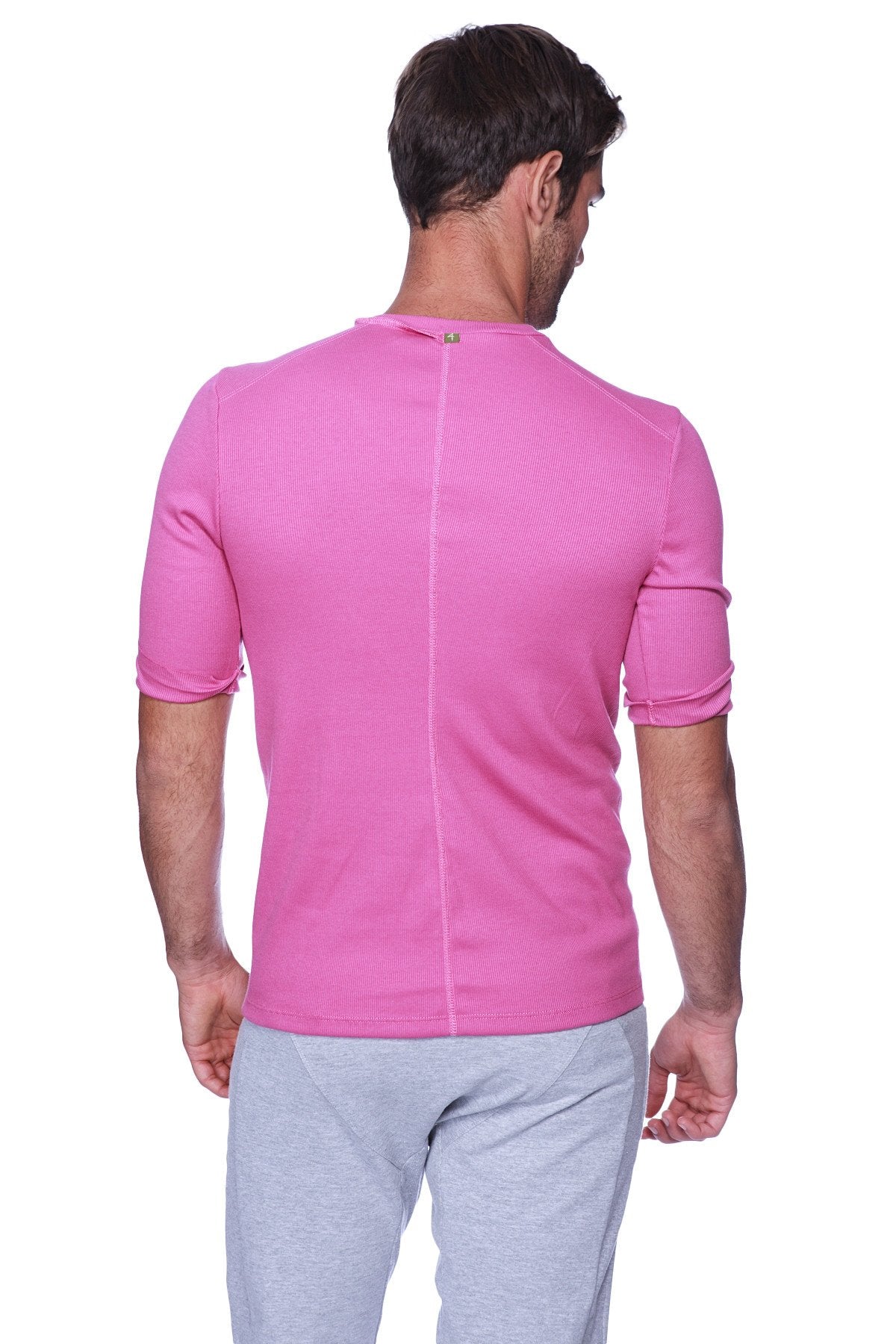 Back view of hybrid v-neck berry short-sleeved athletic shirt in vibrant pink ribbed fabric with vertical seam
