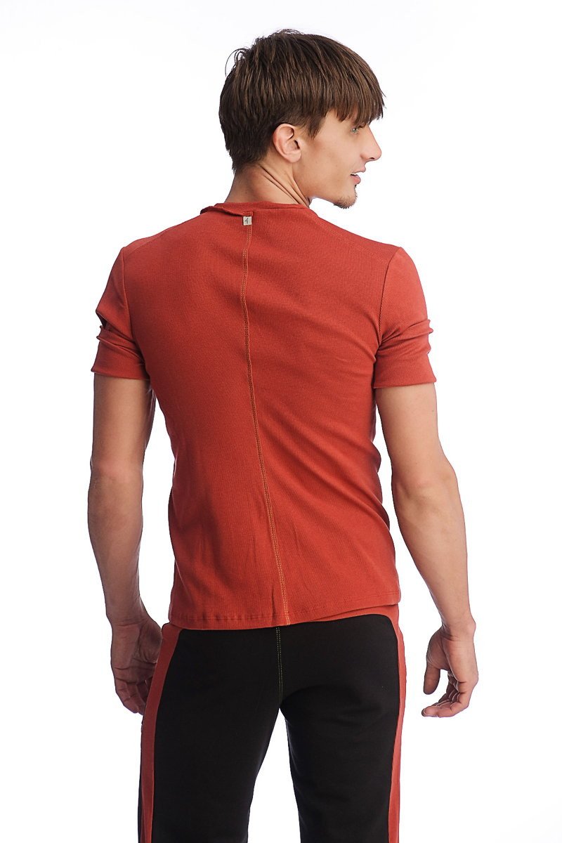 Back view of a sleek rust orange hybrid v neck short-sleeved t-shirt with a subtle vertical seam