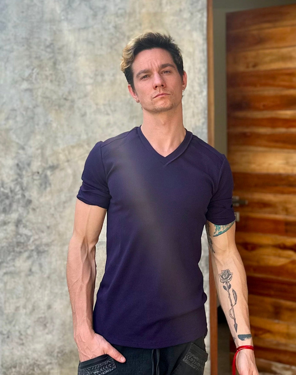 A dark purple cotton hybrid v-neck short-sleeved t-shirt in eggplant purple color shown from the front