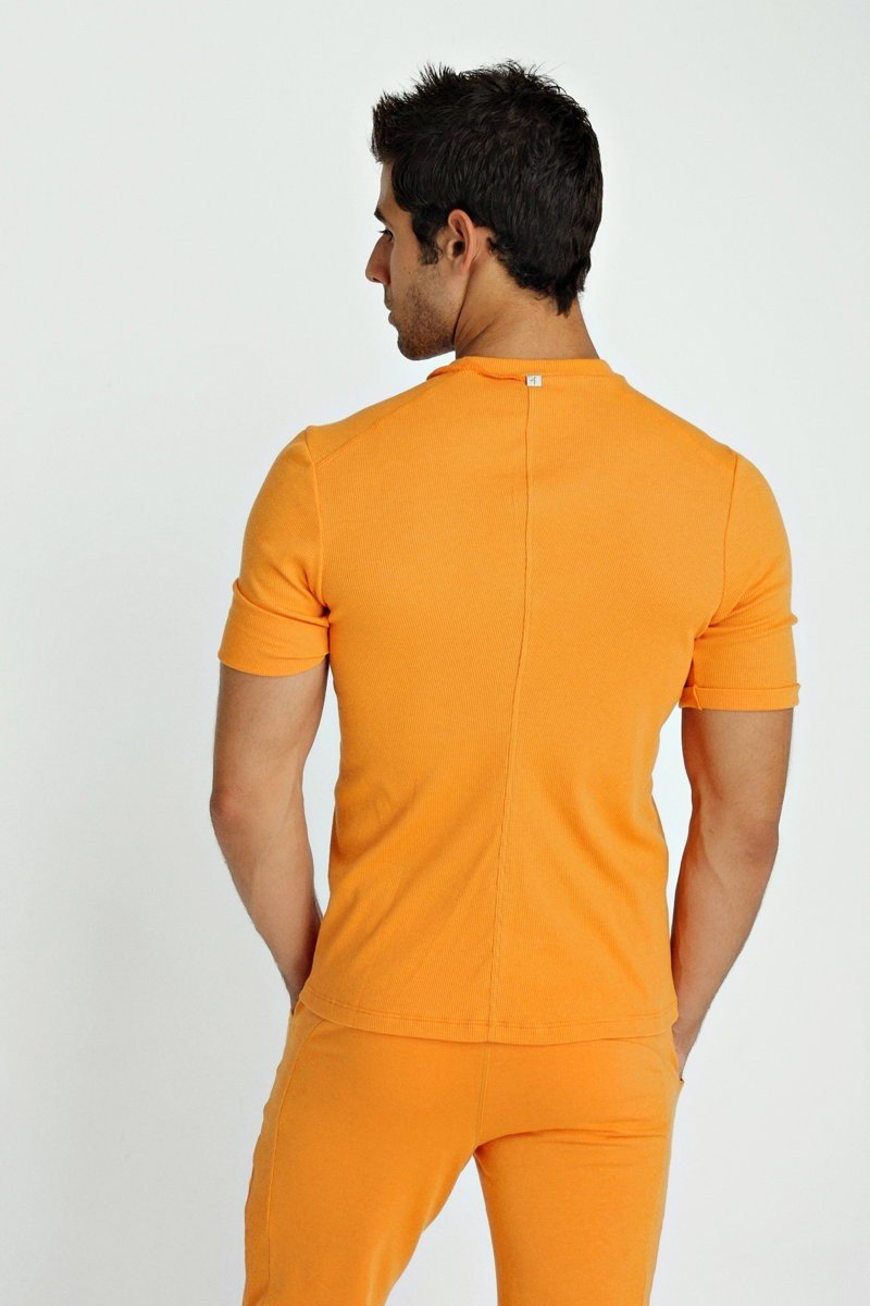 Orange short-sleeved fitted hybrid v-neck t-shirt with central back seam and subtle brand tag at neckline back side view