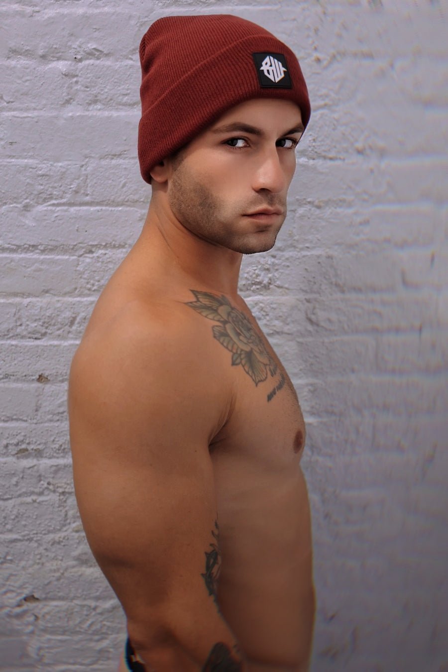 Iconixxx beanie maroon knitted beanie with black embroidered logo patch on front for casual wear