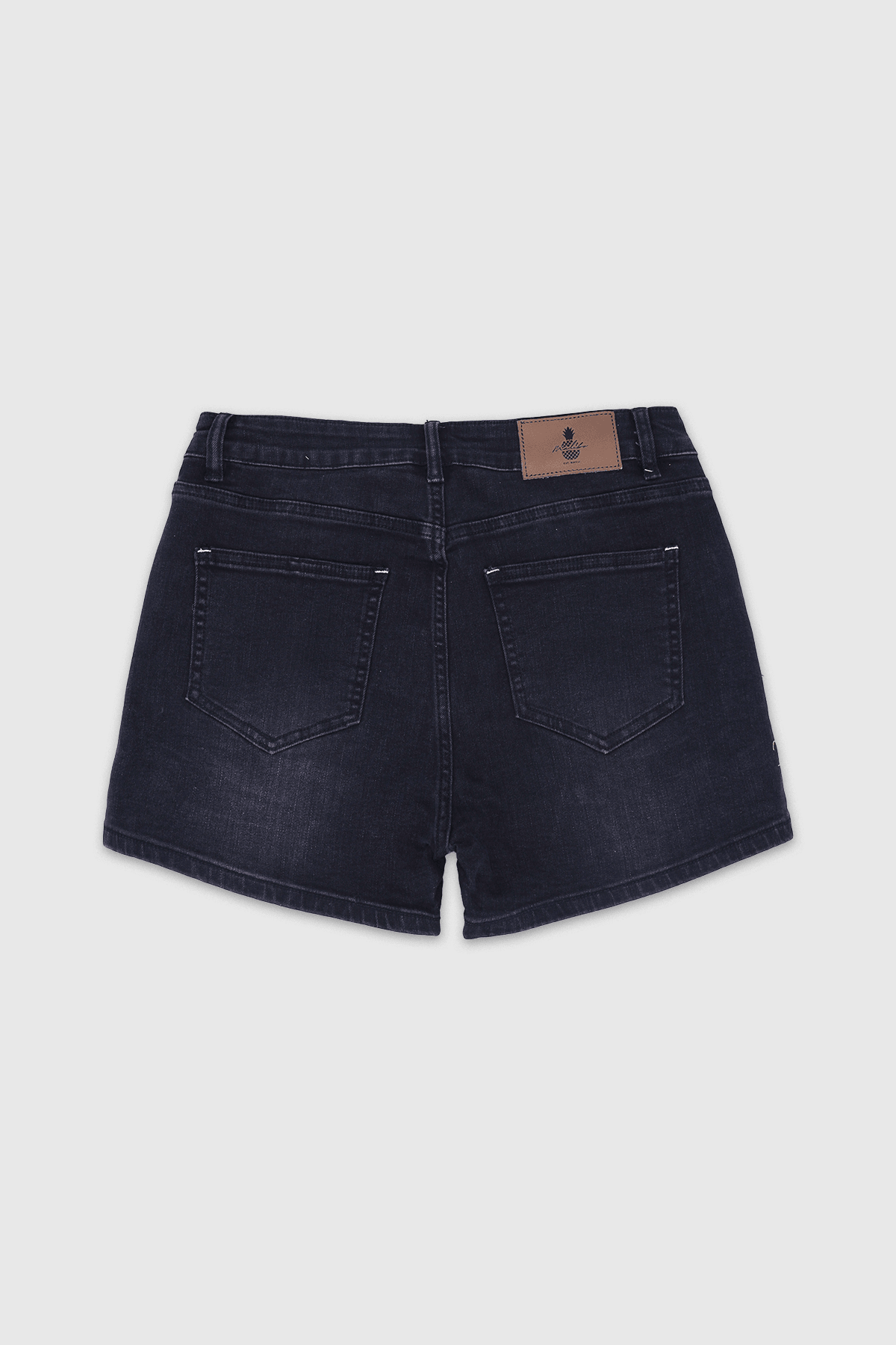 Back view of dark-wash in-your-dreams 3.5 inch denim short shorts with classic pocket design and brown leather patch