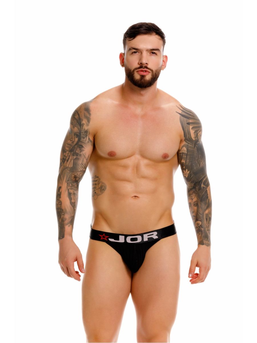 Black jor 2333 cronos thong briefs with white logo and red star detail on waistband visible from front side
