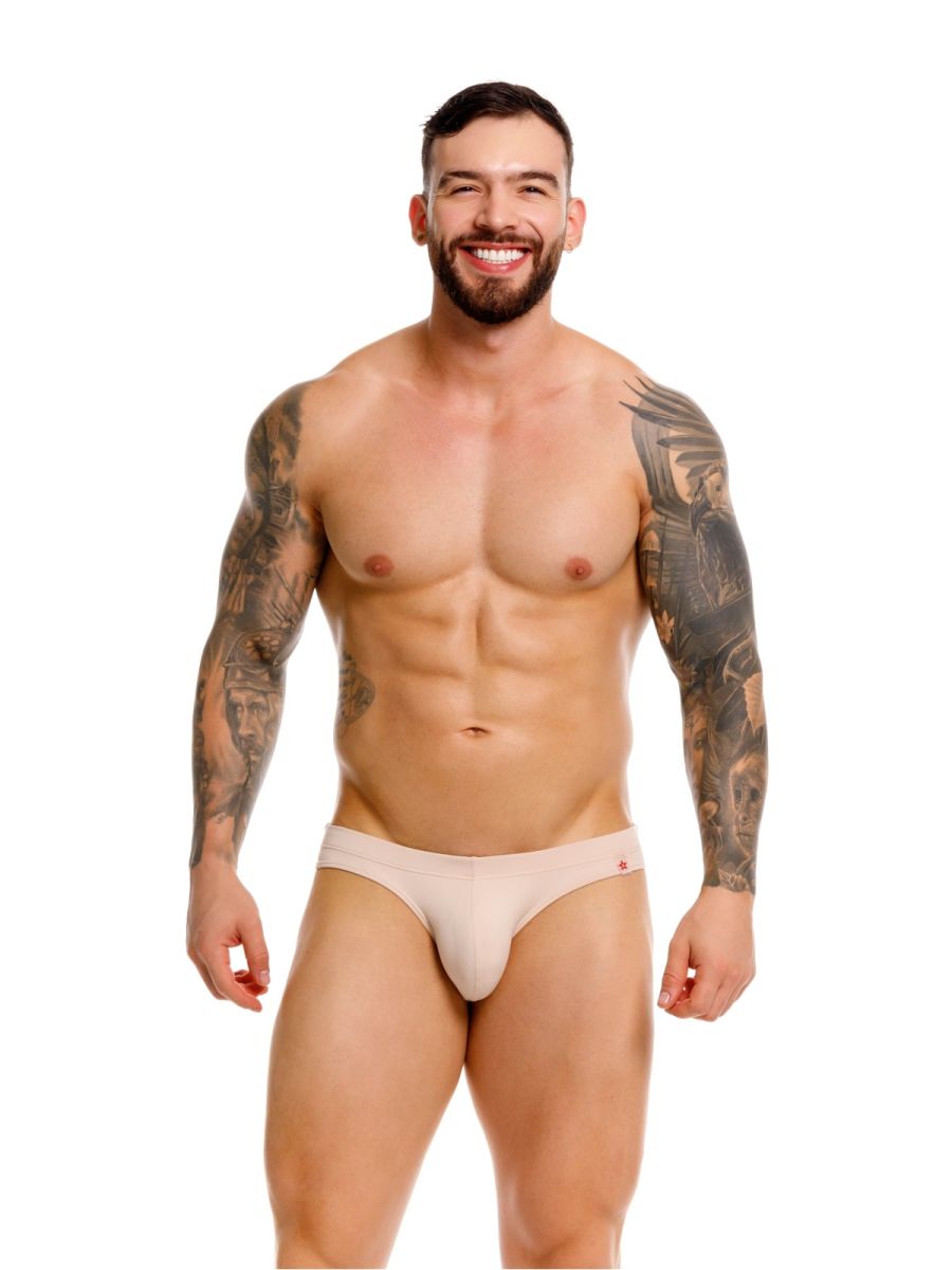 Beige jor 2348 invisible bikini briefs with a subtle red logo on the waistband designed for comfortable athletic wear