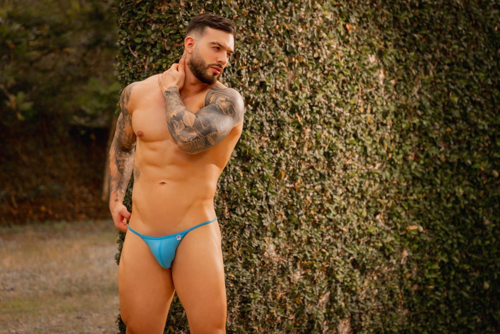 Bright blue jor 2358 axel bikini briefs with a small white logo on the left hipband in turquoise color