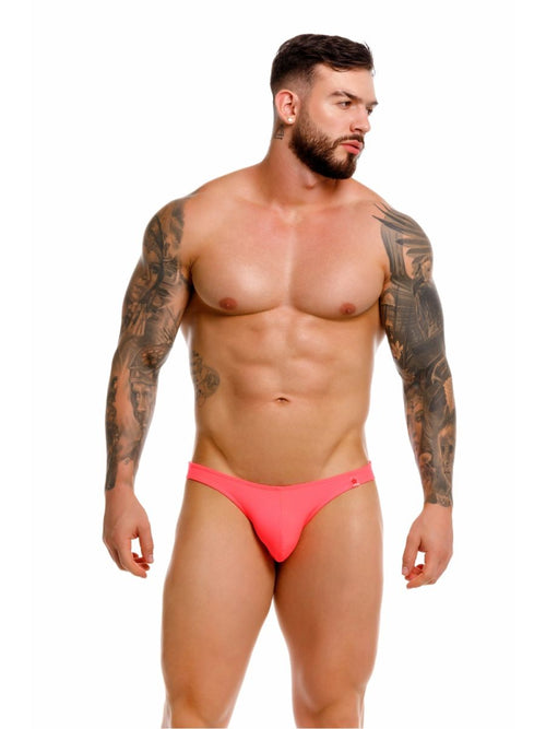 Bright pink form-fitting jor 2389 travel swim thong briefs with subtle brand logo on the side color candy