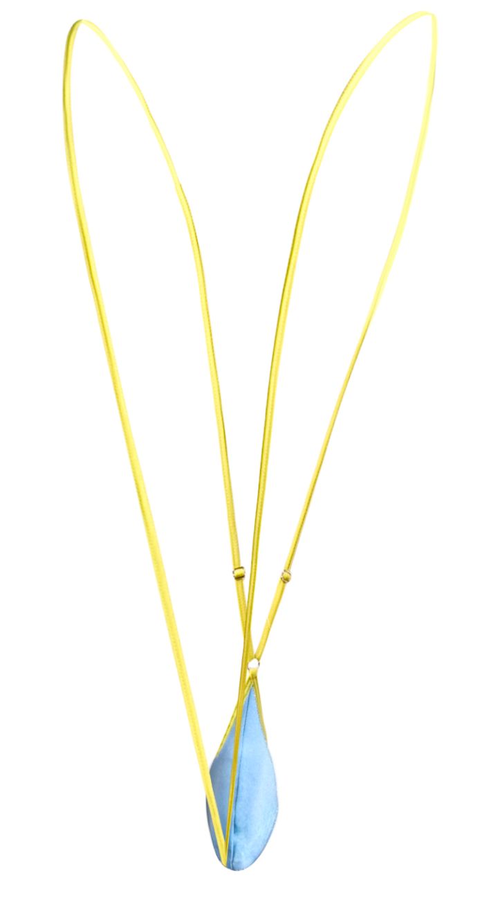 A delicate yellow chain necklace with a single teardrop shaped baby blue pendant from justin and simon