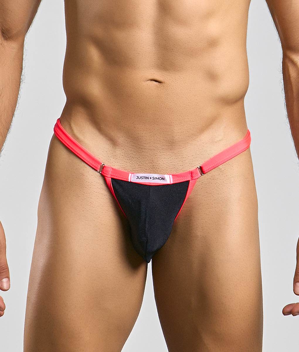 A vibrant red and black thong bikini with a sleek minimalist design from Justin + Simon’s Bikini One collection