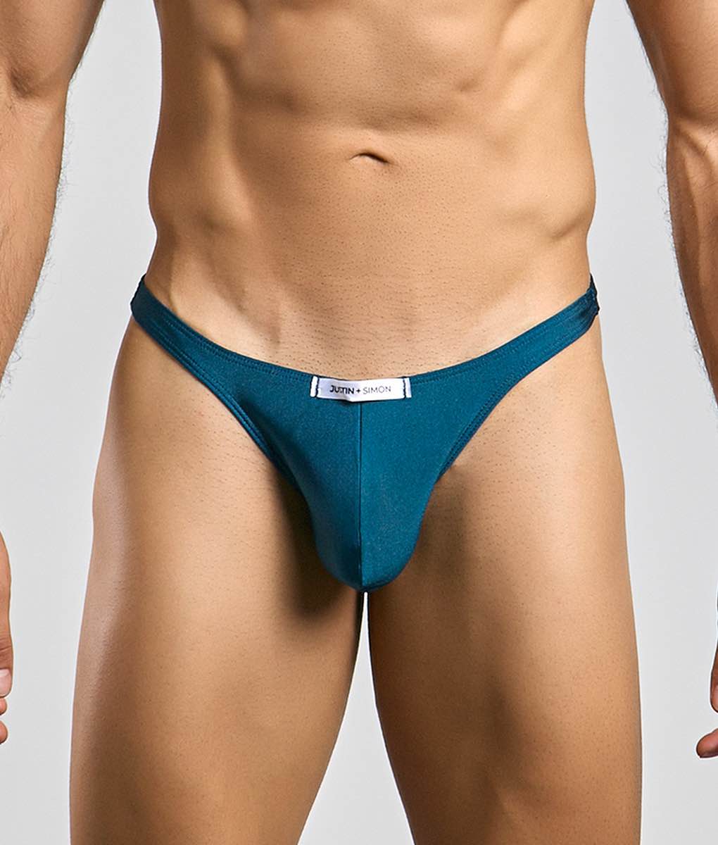 Teal-colored justin and simon classic tanga thong with sleek form-fitting design showing front side