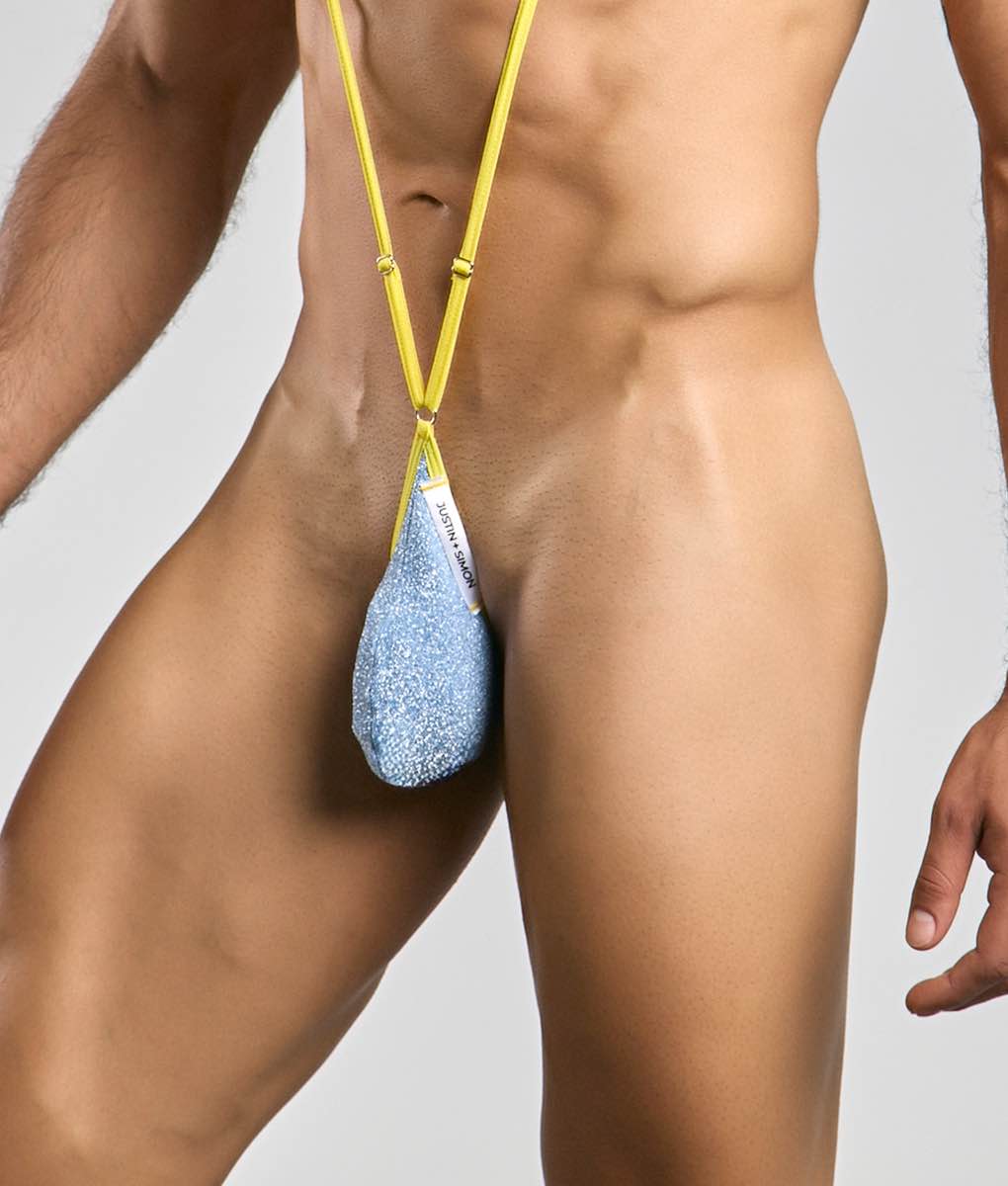 Justin plus Simon sling men’s novelty undergarment in blue glitter with yellow adjustable strap and teardrop shape