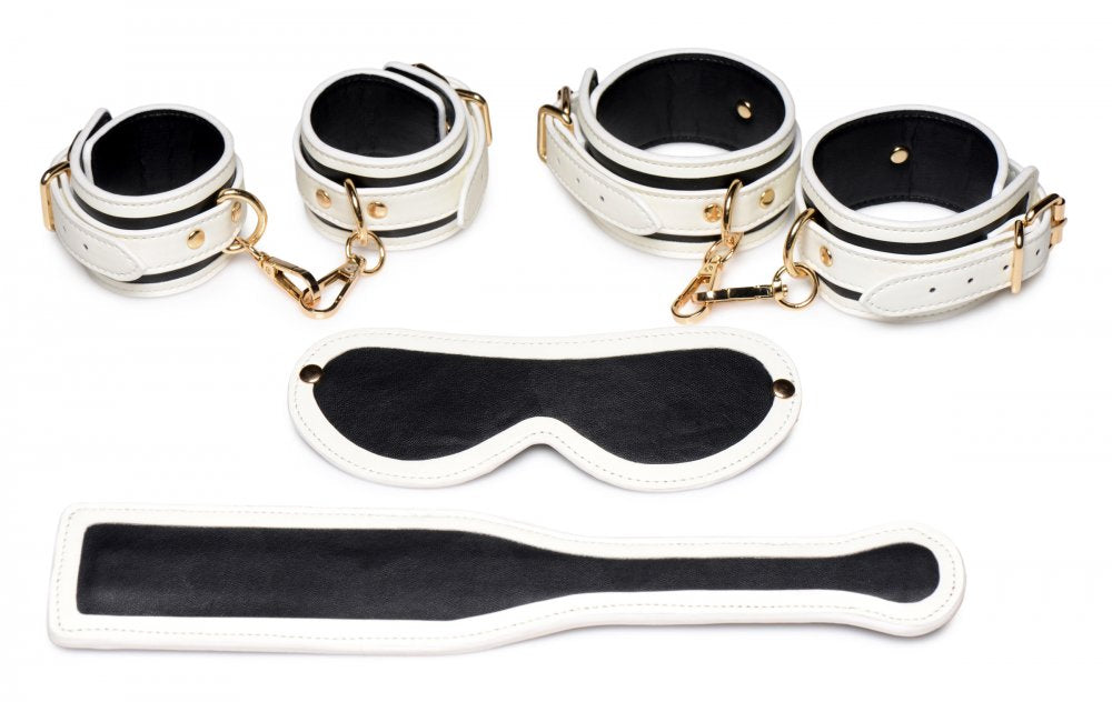 Set de bondage con esposas brillantes Kink in the Dark: venda para los ojos y paleta