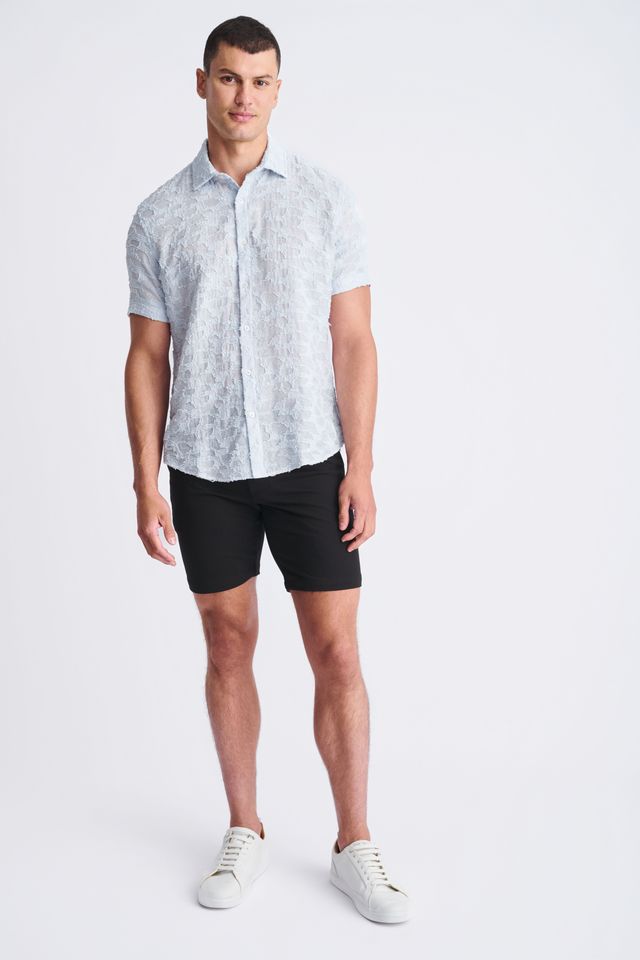 Light blue lightweight jaquard short-sleeved shirt with subtle floral pattern perfect for warm weather wear