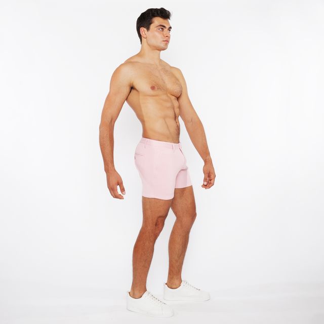 Pink linen-look textured athletic shorts with zip pockets and a clean minimalist design front view