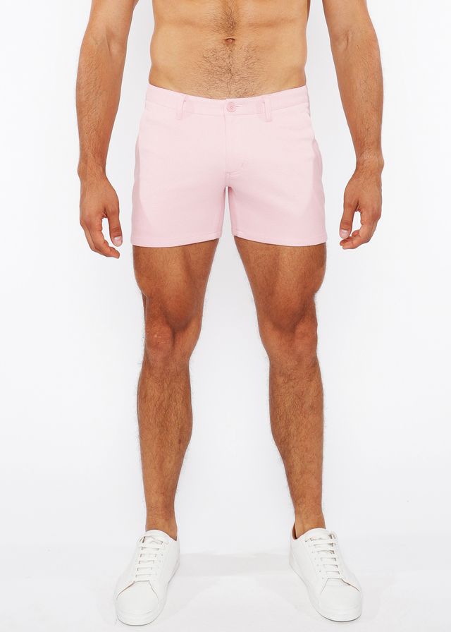 Pink linen-look textured men’s shorts with zip pockets and subtle stitching in a clean tailored fit