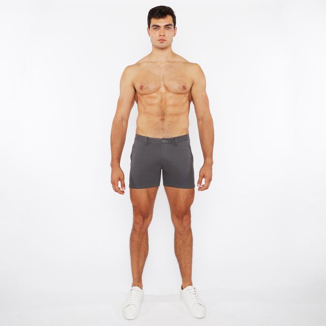 A pair of dark gray linen-look textured slim-fit shorts with zip pockets and a clean modern design