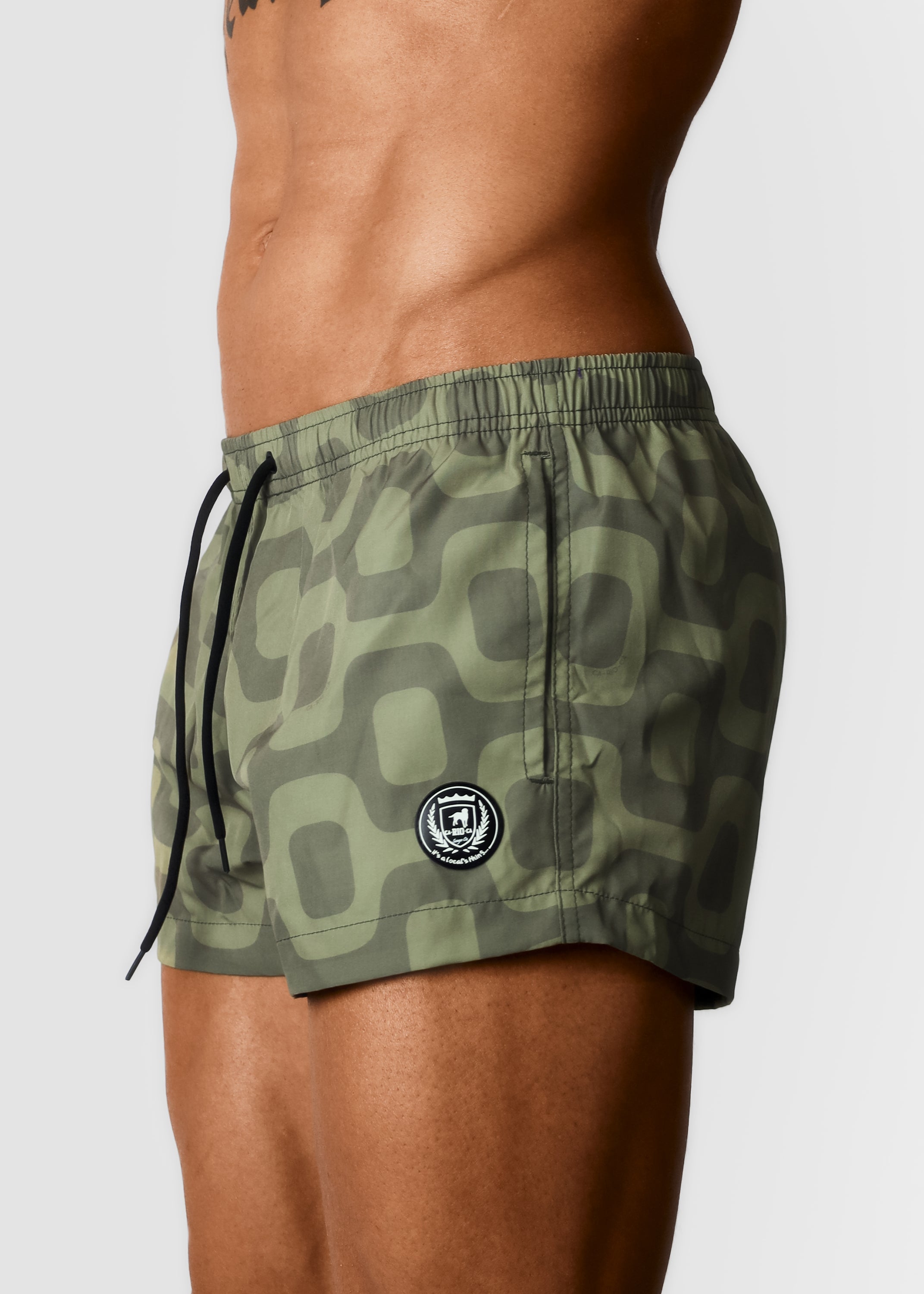 Olive green lebnon pavement italian swim trunks with geometric pattern and black drawstring for casual beachwear