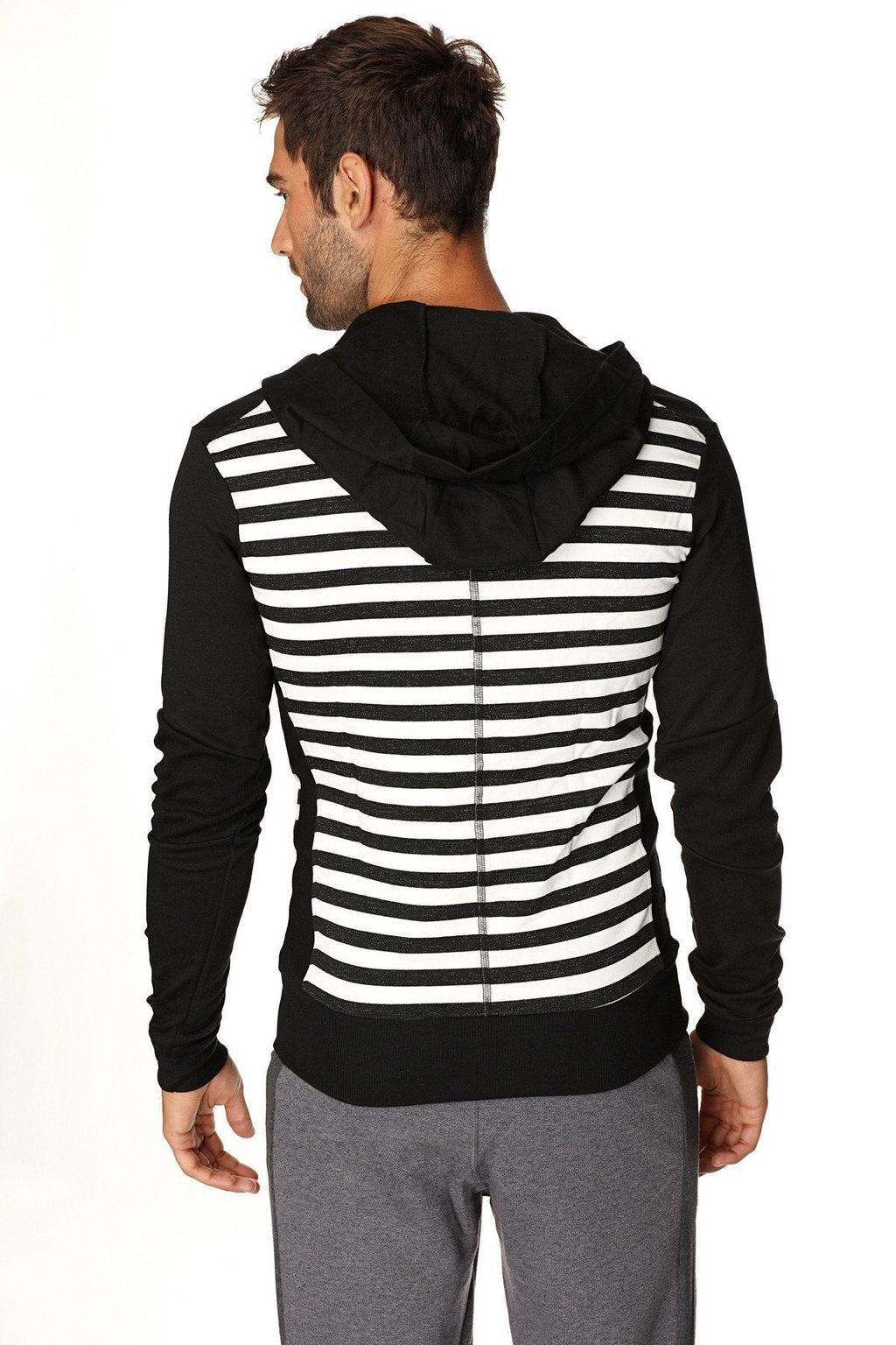 Limited edition form-fit crossover yoga track fleece hoodie in black with white stripes and solid black hood sleeves hem
