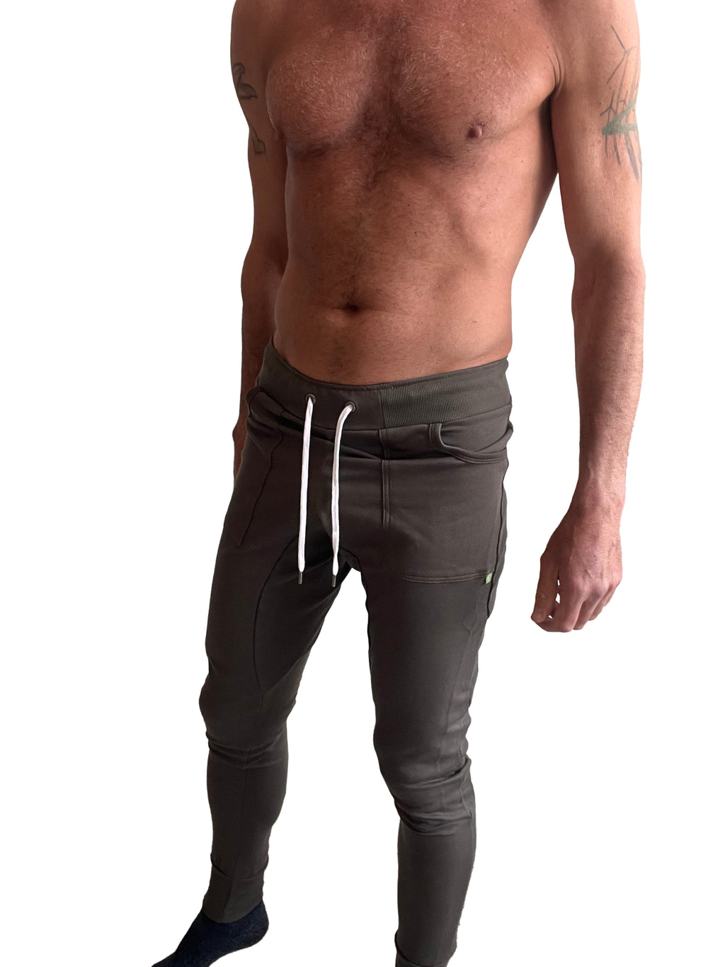 Dark olive green long cuffed jogger and yoga sweat pants with white drawstrings and sleek form-fitting design