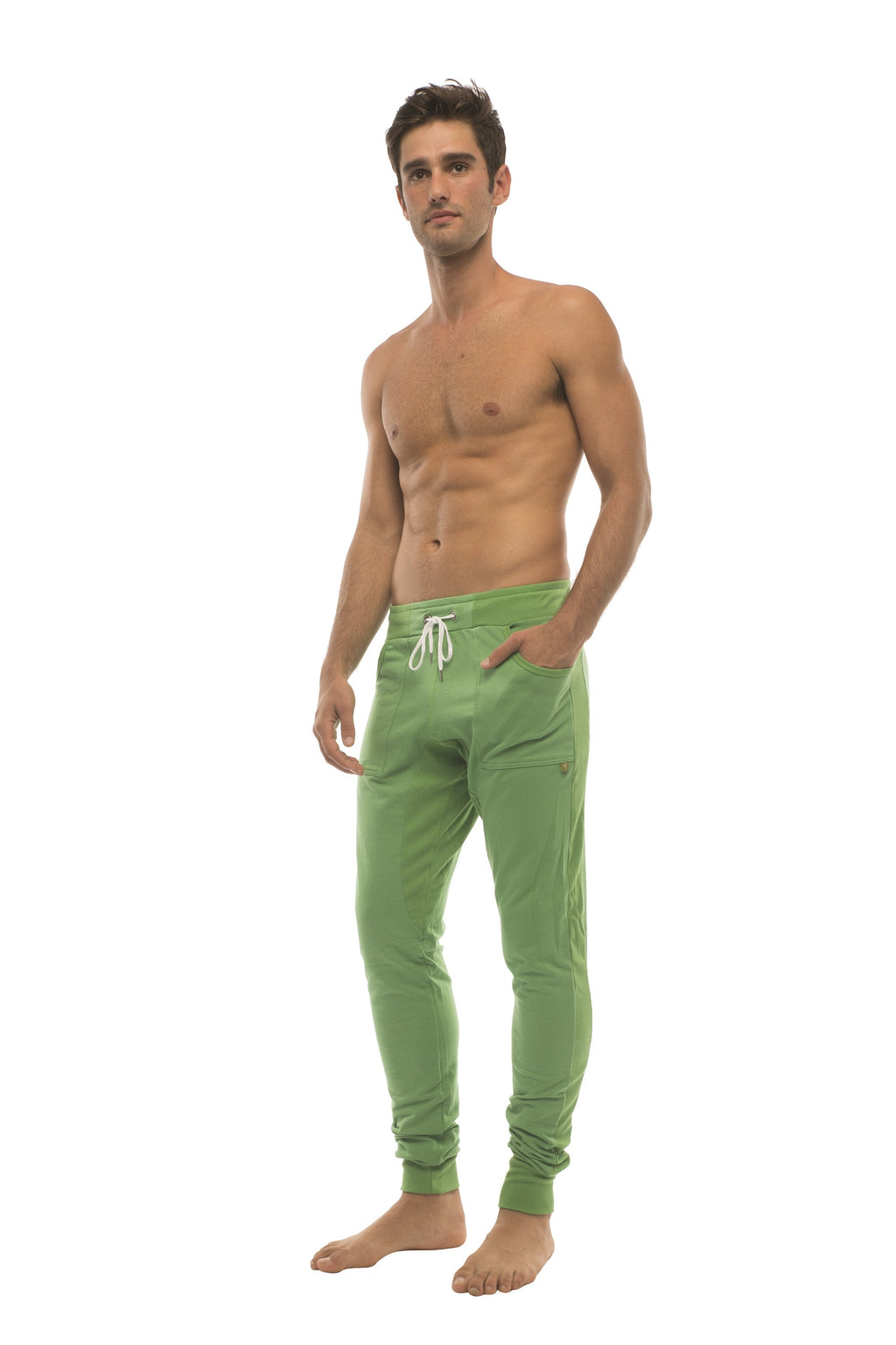 Green long cuffed jogger and yoga sweat pants with white drawstring waistband and side pockets made from bamboo fabric