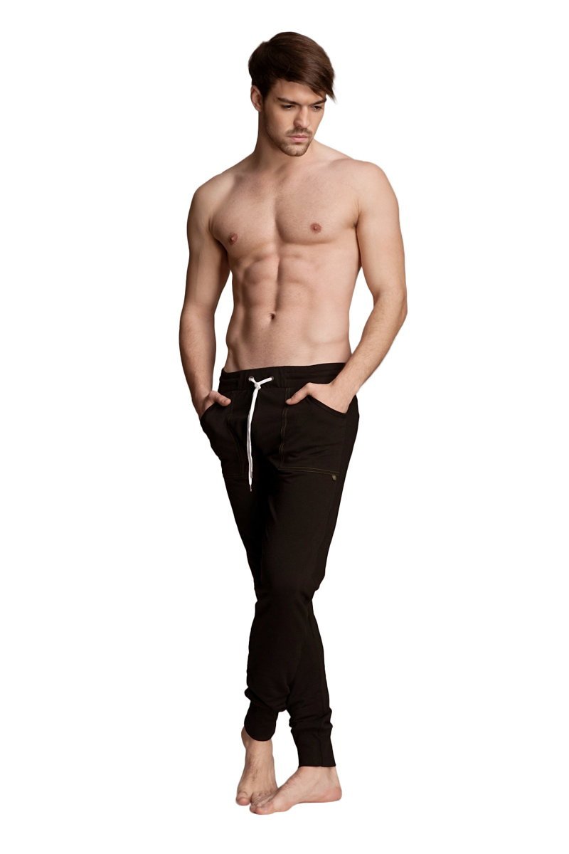 Black long cuffed jogger and yoga sweat pants with white drawstring and subtle side pockets made from soft fabric