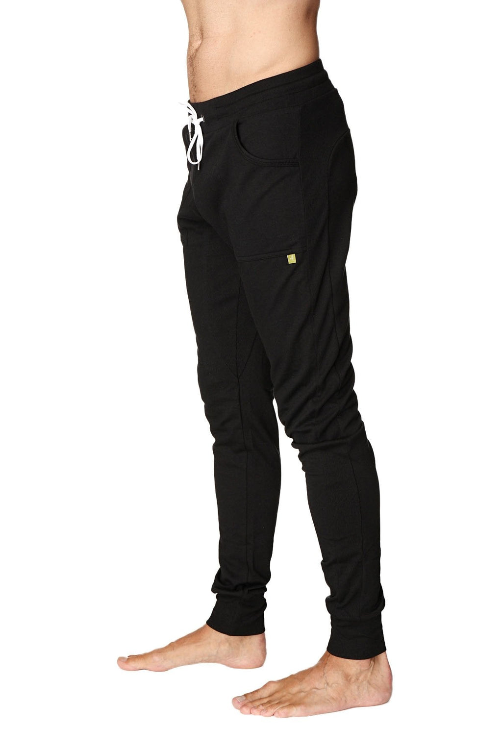 Black long cuffed jogger and yoga sweat pants with white drawstring and small yellow logo on the thigh