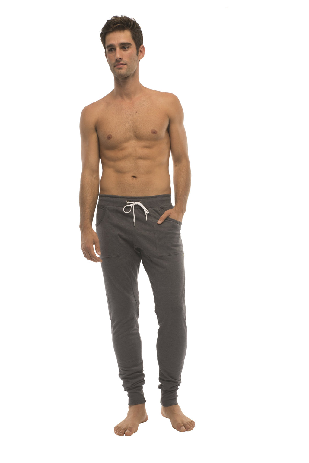 Dark gray long cuffed jogger and yoga sweat pants with white drawstring waistband and elastic cuffs in charcoal