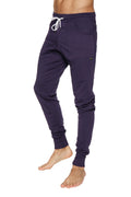 Long cuffed navy blue jogger pants with white drawstring and side pockets for yoga and casual wear