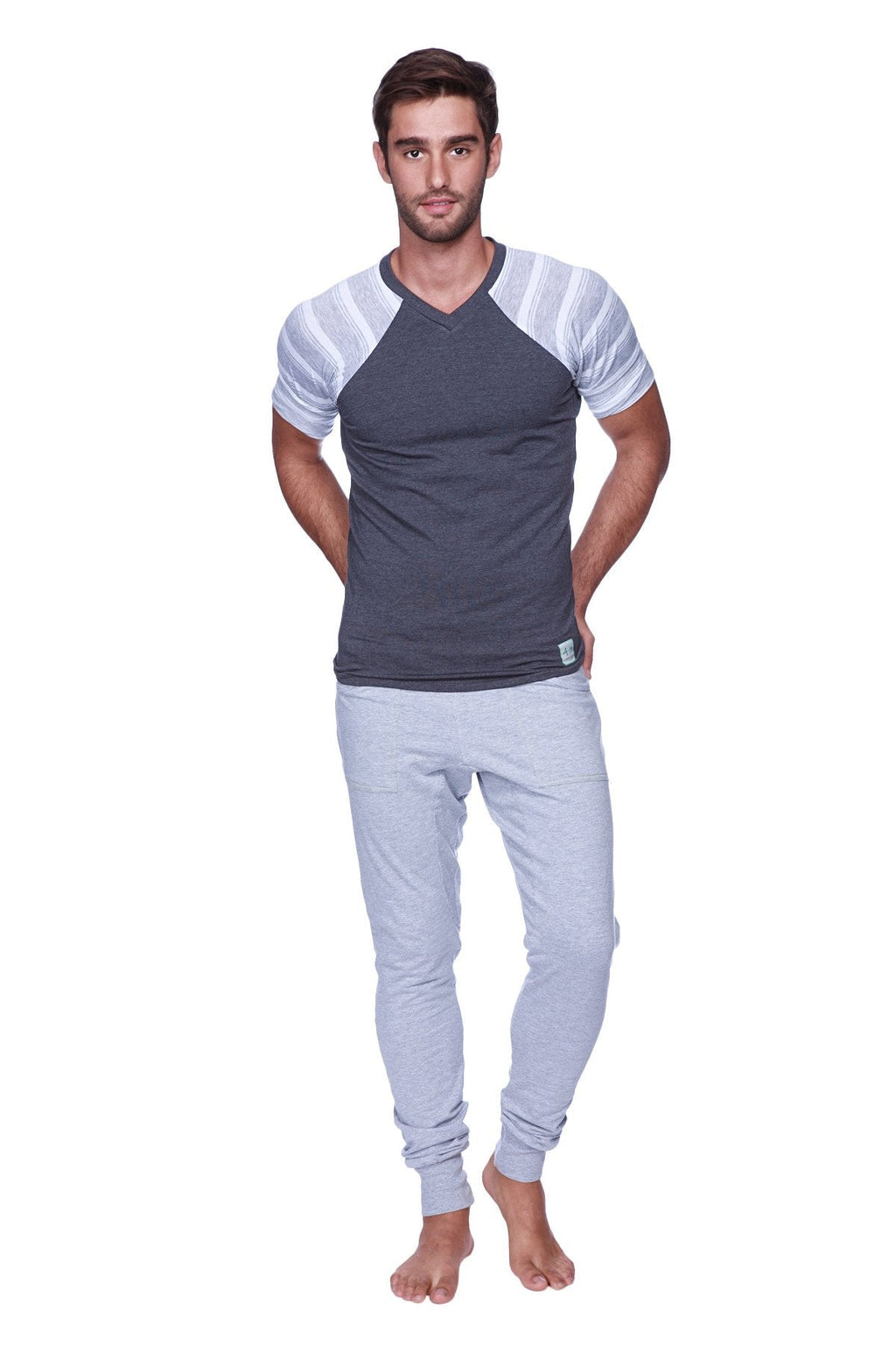 Men’s gray and white striped raglan sleeve v-neck t-shirt paired with heather grey long cuffed jogger and yoga sweat pants
