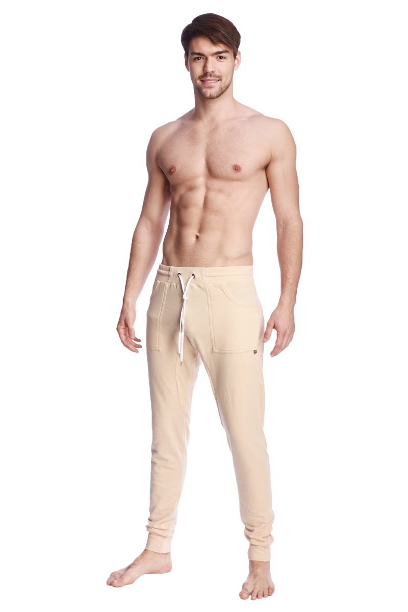 Beige long cuffed jogger and yoga sweat pants with drawstring waistband and side pockets for casual wear