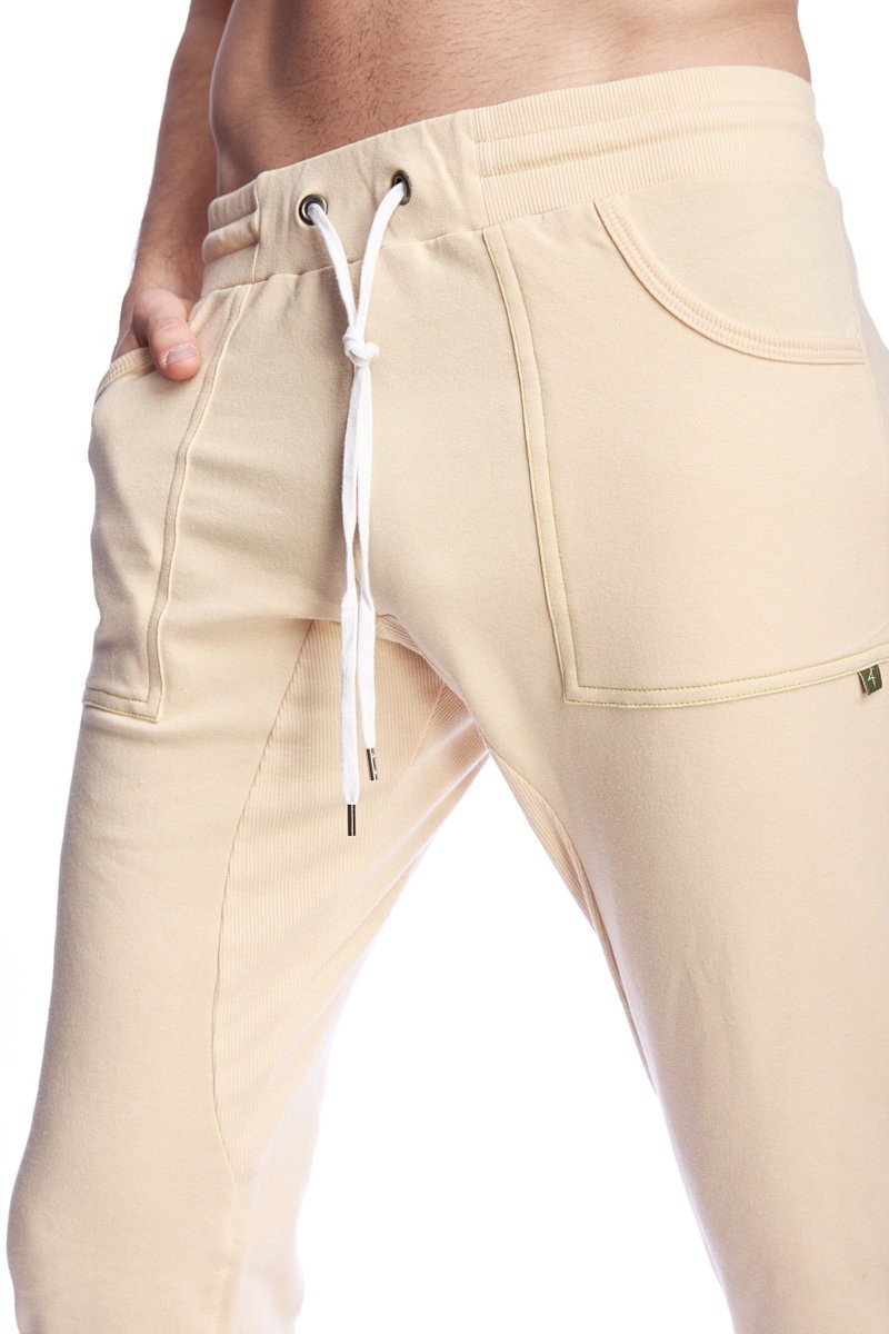 Beige corduroy long cuffed jogger and yoga sweat pants with white drawstring and side pockets