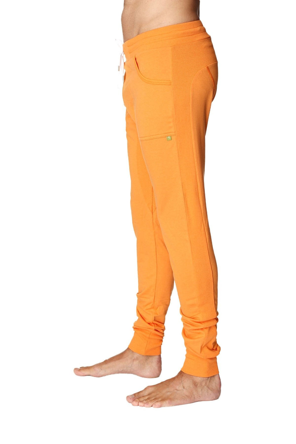 Long cuffed jogger and yoga sweat pants in bright sun orange soft fabric with drawstring waist and rolled cuffs