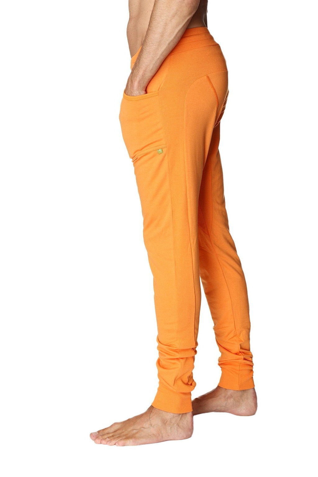 Long cuffed jogger and yoga sweat pants in sun orange with side pockets and a relaxed fit for comfortable wear