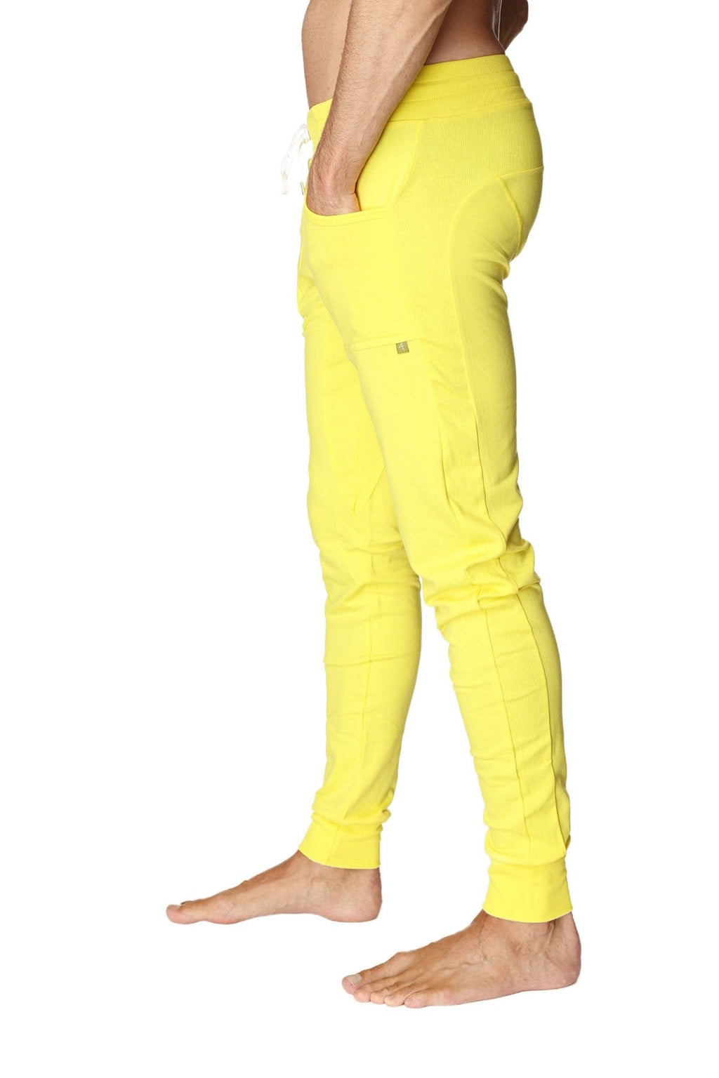 Bright yellow long cuffed jogger and yoga sweat pants with drawstring waist and side pockets for activewear
