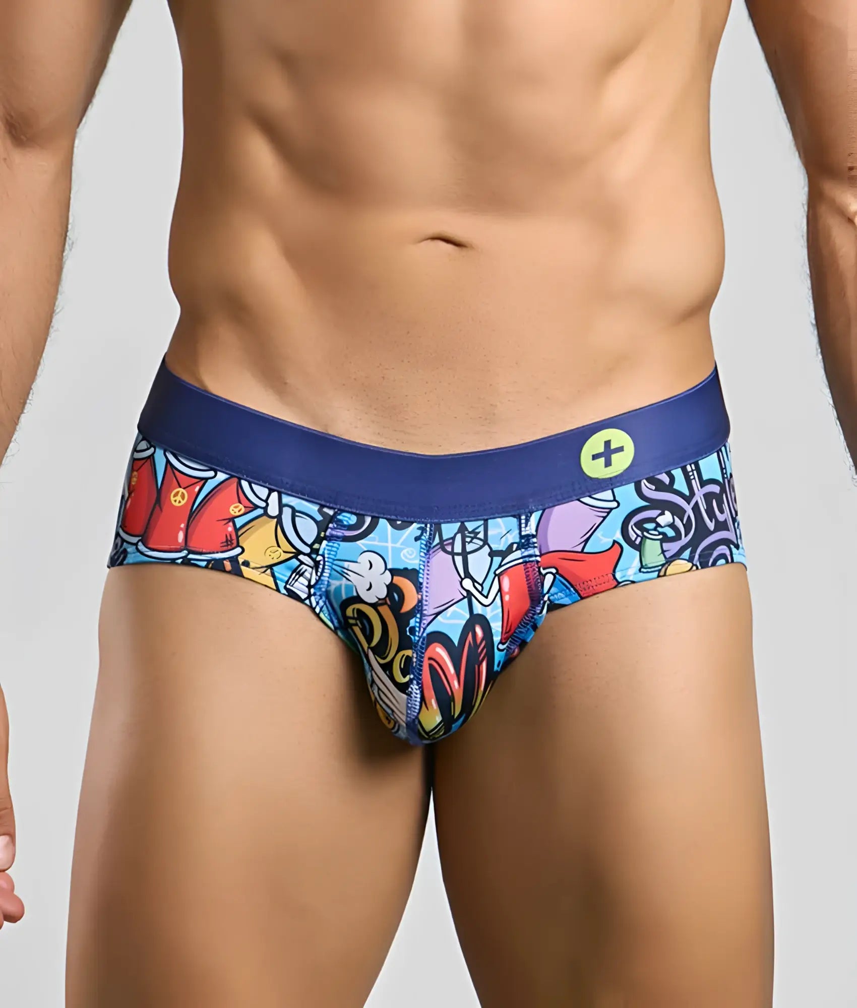 MaleBasics hipster brief with vibrant graffiti print and solid navy blue waistband featuring a small yellow logo