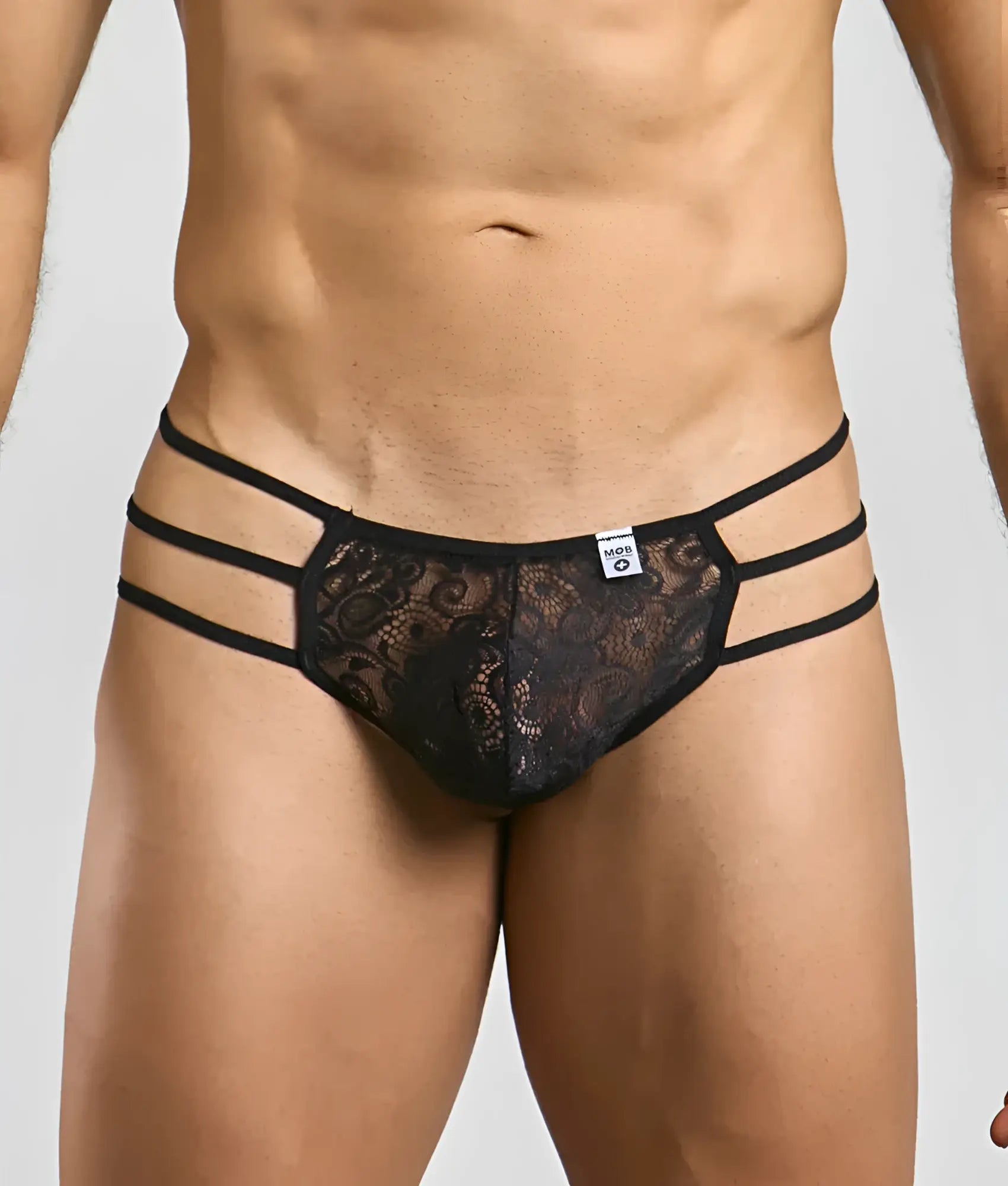 Black lace thong with three horizontal elastic straps featuring a lace pouch designed for men by MOB
