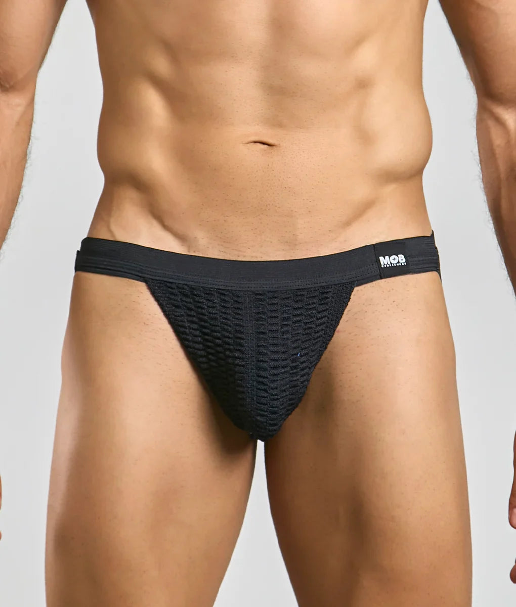 Black mesh swim jockstrap briefs with solid waistband featuring mos brand logo for stylish swimwear