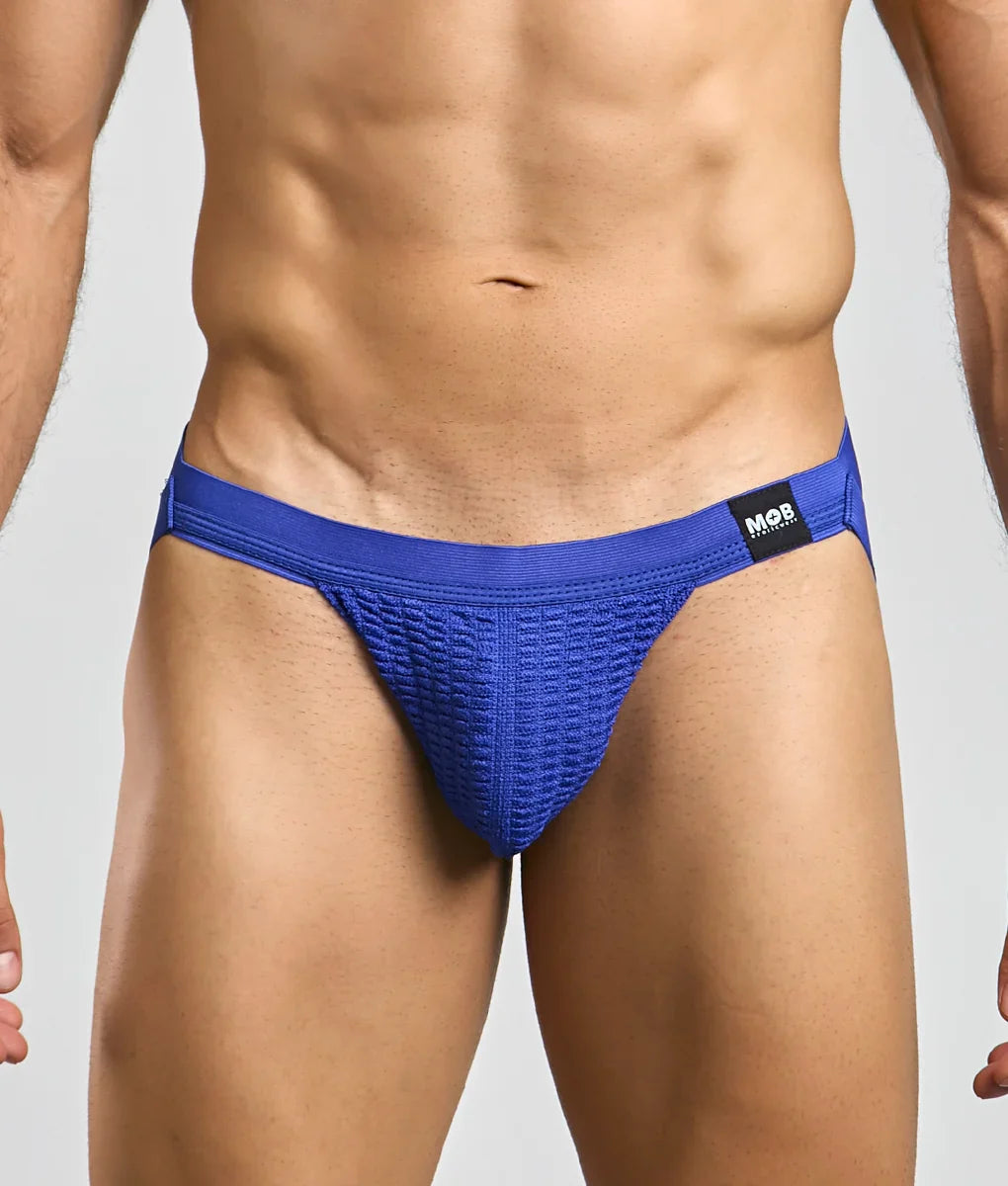 Blue textured athletic swim jockstrap briefs with black mob brand tag on waistband for active use