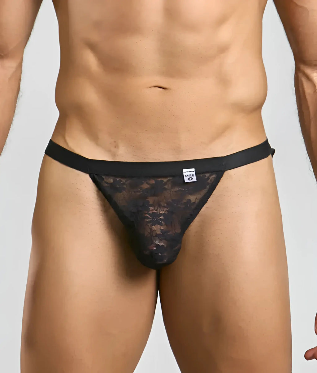 Black lace MOB Y sexy thong with solid black waistband and floral pattern shown from the back side