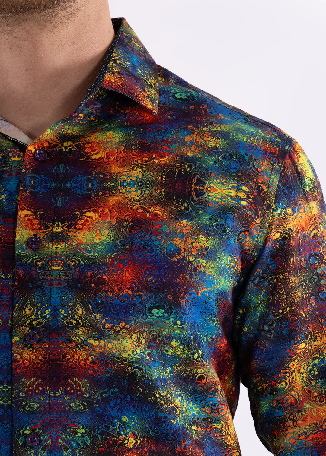 Multicolor patterned long sleeve shirt with vibrant iridescent kaleidoscopic design in blues reds oranges and greens
