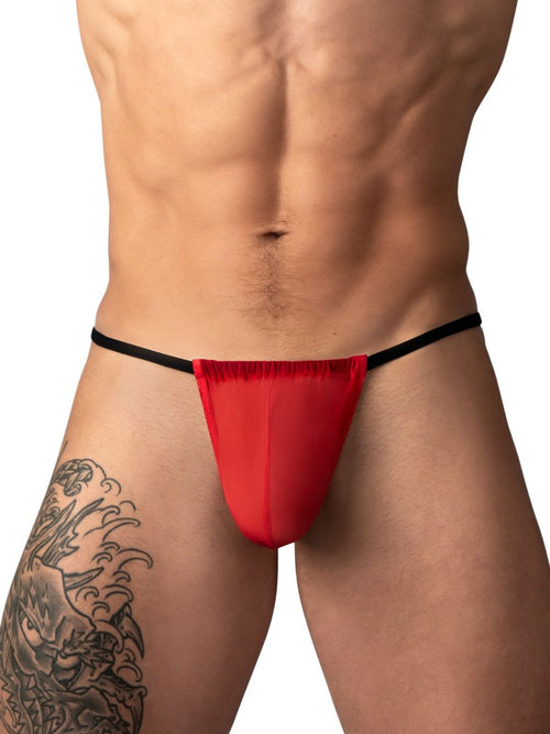 Red Male Power mesh G-string with thin black waist straps on a man with a leg tattoo.