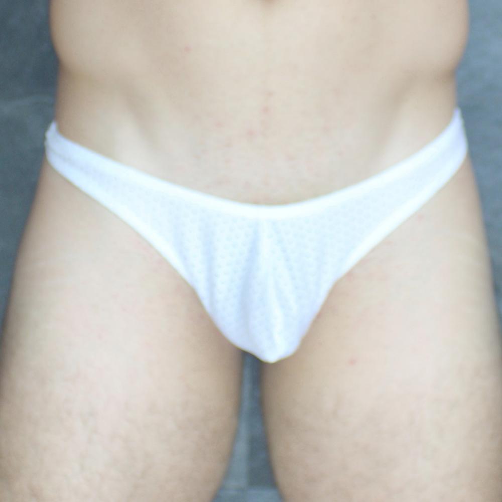 White cotton Mckillop MCKVTPL thong briefs with seamless design shown from the back side