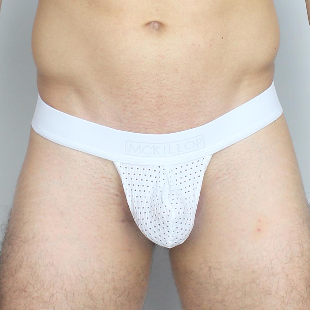 White mesh thong with solid white waistband and mckillor brand name showing the back side in mckillop mppl max bulge pouch expose