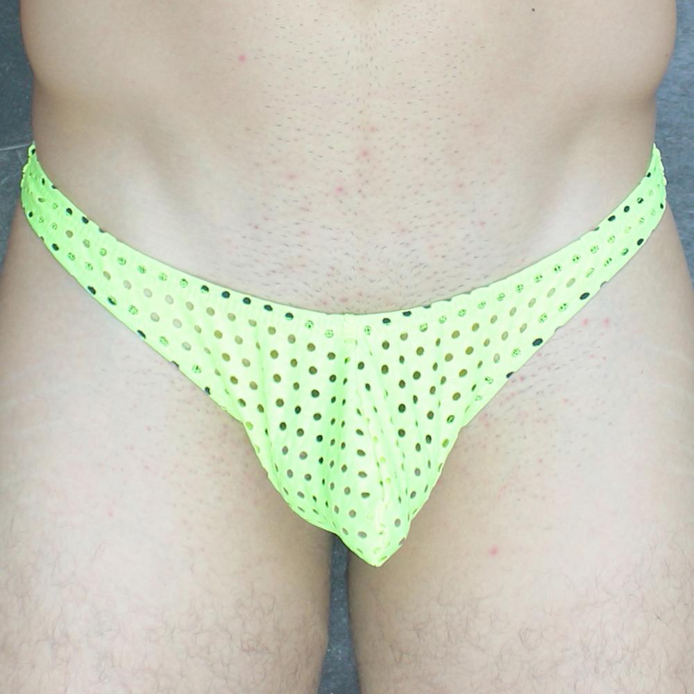 Neon green mesh thong with black polka dots in mckillop vthq hoist thong glory lycra fabric visible from front view
