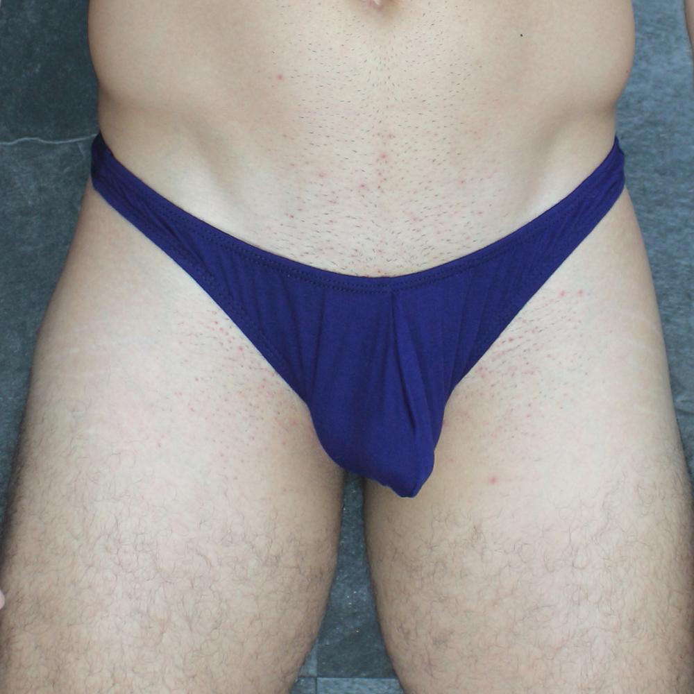 Navy blue mckillop vtmo hoist thong made of stretchy modal fabric with a gathered front design